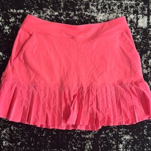 Gently used Under Armour golf Skort, size M, neon pink